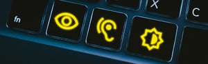Close-up of a keyboard with yellow symbols clearly visible on the keys