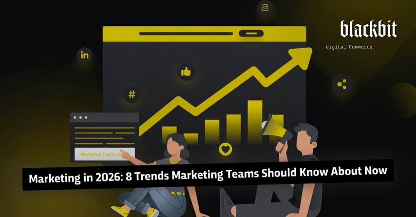 Двоє людей обговорюють перед графіком маркетингові тенденції 2026 року з діаграмами зростання та символами соціальних мереж.